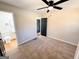 Bedroom features carpeting, ceiling fan, closet and neutral paint at 1209 Topaz Ln, Villa Rica, GA 30180