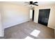 Bedroom with carpeting, ceiling fan, closet and neutral paint at 1209 Topaz Ln, Villa Rica, GA 30180