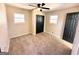 Bedroom features carpeting, ceiling fan, closet and neutral paint at 1209 Topaz Ln, Villa Rica, GA 30180