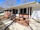Close-up view showcasing the front porch, complete with wrought iron railings and classic brickwork at 1209 Topaz Ln, Villa Rica, GA 30180