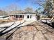 Well-maintained exterior of home with an extended driveway, a brick facade, and neutral paint colors at 1209 Topaz Ln, Villa Rica, GA 30180