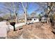 Cozy single-story home with a large front yard, mature trees, and an inviting mailbox and driveway at 1209 Topaz Ln, Villa Rica, GA 30180