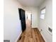 Hallway with dark-stained doors and wood-grain vinyl floors at 1209 Topaz Ln, Villa Rica, GA 30180