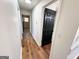 Hallway with wood-grain vinyl floors and black interior doors at 1209 Topaz Ln, Villa Rica, GA 30180