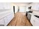 Modern kitchen with stainless steel appliances and ample white cabinets at 1209 Topaz Ln, Villa Rica, GA 30180