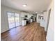 Open kitchen featuring modern appliances, white cabinetry, and hardwood floors connecting to a deck at 1209 Topaz Ln, Villa Rica, GA 30180