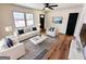 Stylishly furnished living room featuring hardwood floors, white furniture, and eye-catching blue accents at 1209 Topaz Ln, Villa Rica, GA 30180