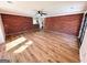 Spacious living room with brick wall and hardwood floors at 1209 Topaz Ln, Villa Rica, GA 30180