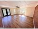 Spacious living room featuring multiple windows providing natural light and wood-grain vinyl floors at 1209 Topaz Ln, Villa Rica, GA 30180