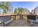 Back deck area with wooded views and plenty of space for seating and grilling at 536 Caledon Way, Hampton, GA 30228
