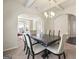 Formal dining room with coffered ceilings, carpet, and neutral walls at 536 Caledon Way, Hampton, GA 30228