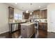 Modern kitchen featuring stainless steel appliances, granite countertops and a center island at 536 Caledon Way, Hampton, GA 30228