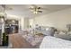 Open living room with hardwood and carpet and view of the kitchen at 536 Caledon Way, Hampton, GA 30228