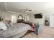 Spacious main bedroom featuring a sitting area, en suite bath, and lots of natural light at 536 Caledon Way, Hampton, GA 30228