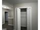 Bedroom closet with shelving and white doors for organized storage at 305 Magnolia Gardens Walk, Mcdonough, GA 30253