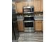 Close up on the stainless steel appliances and light wood cabinets in kitchen at 305 Magnolia Gardens Walk, Mcdonough, GA 30253