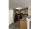 Modern kitchen with stainless steel appliances, hardwood flooring, and light wood cabinets at 305 Magnolia Gardens Walk, Mcdonough, GA 30253