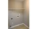 Laundry room with washer and dryer hookups and a single wire shelf at 305 Magnolia Gardens Walk, Mcdonough, GA 30253
