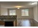 Bright living room featuring hardwood floors and sliding glass doors leading to the backyard at 305 Magnolia Gardens Walk, Mcdonough, GA 30253