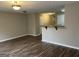 Open-concept living room featuring hardwood floors and neutral paint at 305 Magnolia Gardens Walk, Mcdonough, GA 30253