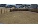 Expansive backyard with lush lawn and secure wooden fence, ideal for recreation and privacy at 1879 Redfern Rd, Dacula, GA 30019