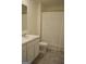 Bathroom features a single sink vanity, toilet, and shower with a curtain at 1879 Redfern Rd, Dacula, GA 30019