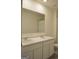 Bright bathroom features a double sink vanity with white cabinets and marble countertop at 1879 Redfern Rd, Dacula, GA 30019