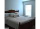 Comfortable bedroom with a plush bed, soft pillows, and a window bringing in natural light at 1879 Redfern Rd, Dacula, GA 30019