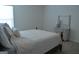 Bright bedroom featuring natural light, neutral walls, and an inviting bed with stylish dresser at 1879 Redfern Rd, Dacula, GA 30019