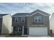 Charming two-story home features a mix of brick and stone exterior at 1879 Redfern Rd, Dacula, GA 30019
