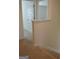 Hallway showcasing staircase, neutral walls and carpet, and modern doors, creating a seamless flow at 1879 Redfern Rd, Dacula, GA 30019