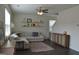 Bright living room with a cozy sectional sofa, decorative shelves, and an accent rug at 1879 Redfern Rd, Dacula, GA 30019