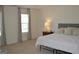 Spacious main bedroom featuring neutral tones, carpeted floors, and bright windows at 1879 Redfern Rd, Dacula, GA 30019