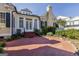 Charming home featuring a brick patio, well-manicured landscaping, and classic architectural details at 3786 Turnberry Ct, Duluth, GA 30096
