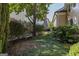 Secluded backyard with mature landscaping and a comfortable bench at 3786 Turnberry Ct, Duluth, GA 30096
