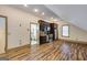 A small kitchen with stainless steel appliances, dark cabinets, and hardwood floors at 3786 Turnberry Ct, Duluth, GA 30096