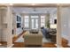 Welcoming living room with cozy sofas, built-in shelves, and lots of natural light streaming in at 3786 Turnberry Ct, Duluth, GA 30096