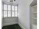 A small room featuring white walls, a window with blinds, and an open closet at 3786 Turnberry Ct, Duluth, GA 30096