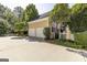 Attached two-car garage with ample driveway space on a sunny day at 3786 Turnberry Ct, Duluth, GA 30096