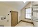 A laundry room featuring a small window, a washer hookup, and shelves at 3786 Turnberry Ct, Duluth, GA 30096