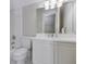 This primary bathroom offers tile flooring, a toilet, and vanity sink with storage at 3786 Turnberry Ct, Duluth, GA 30096
