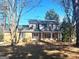 Charming two-story brick home with a welcoming front porch and well-manicured landscaping at 6740 Davidson Ct, Lithonia, GA 30058