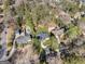 An aerial view showcases this home's location among mature trees and a nearby swimming pool at 4217 Paces Ferry Se Rd, Atlanta, GA 30339