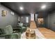 Spacious finished basement featuring comfortable seating and elegant lighting fixtures at 4217 Paces Ferry Se Rd, Atlanta, GA 30339