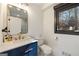 Modern bathroom with marble countertop, sleek fixtures, and a glass-enclosed shower at 4217 Paces Ferry Se Rd, Atlanta, GA 30339