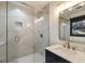 Modern bathroom with tiled shower, stylish vanity and fixtures at 4217 Paces Ferry Se Rd, Atlanta, GA 30339