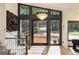 Elegant foyer showcasing a modern chandelier, staircase, and a view to the front yard at 4217 Paces Ferry Se Rd, Atlanta, GA 30339
