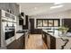 Well-equipped kitchen with stainless steel appliances and island with marble countertop at 4217 Paces Ferry Se Rd, Atlanta, GA 30339