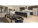 Modern kitchen with stainless appliances, large island, dark wood cabinets and bench seating at 4217 Paces Ferry Se Rd, Atlanta, GA 30339