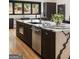 Beautiful kitchen island featuring a breakfast bar and built-in appliances at 4217 Paces Ferry Se Rd, Atlanta, GA 30339